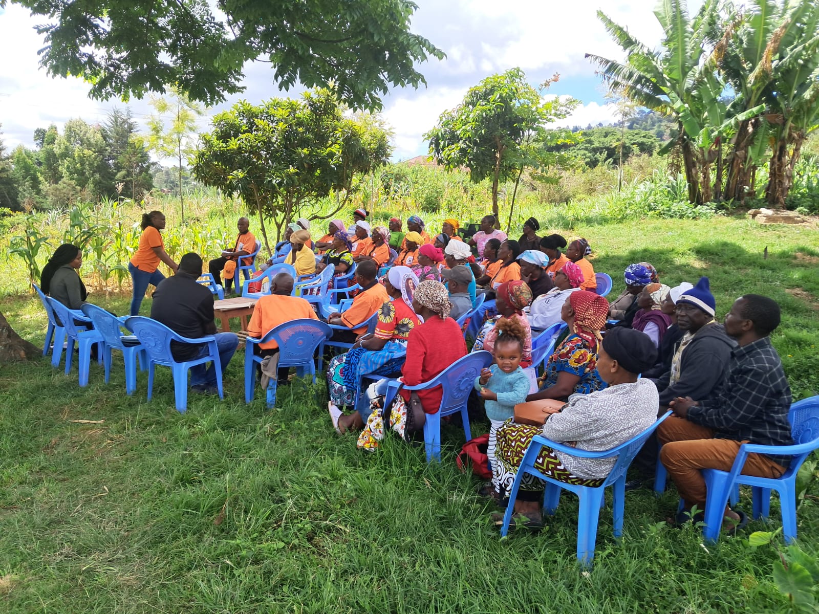 Community consultation with women's groups and elders — the conversation that shapes every strategy we write.